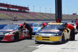 Drive a NASCAR style stock car race at Charlotte Motor Speedway, North Carolina
