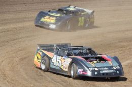 Driving a race car on dirt track at Charlotte's Carolina Speedway